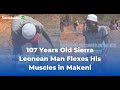107 years old sierra leonean man flexes his muscles inmakeni