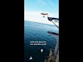 Race plane gets up close with cliff diver for the perfect shot in Polignano 📷 #shorts