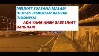 Suasana malam hari melihat kendaran di atas jembatan banjar