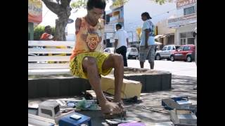 Man born without arms makes toy cars for a living  Credit Caters News Agency