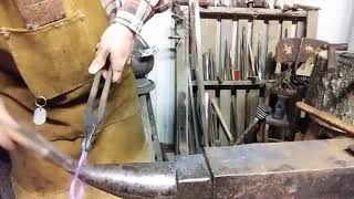 Snowman ornament from a ring of steel pipe