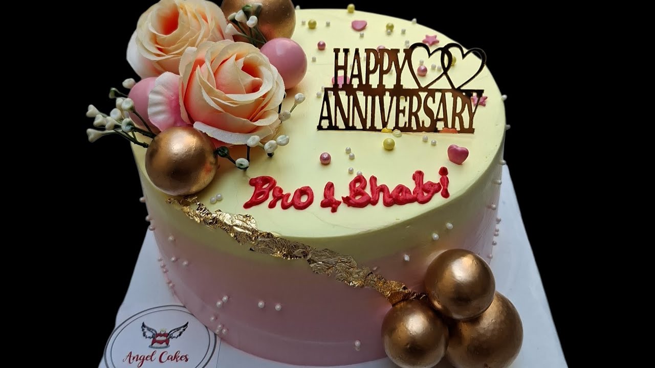 1kg  beautiful anniversary cake decor in mix fruit flavour with yellow and pink icing
