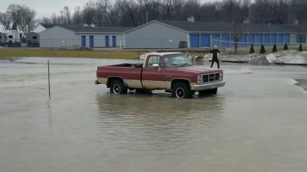 Man Surfs a Flooded Parking Lot in Shipshewana, Indiana YouTube