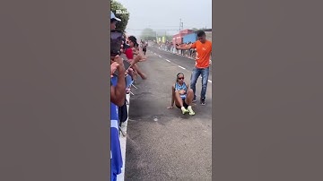 Determined runner crawls over the finish line