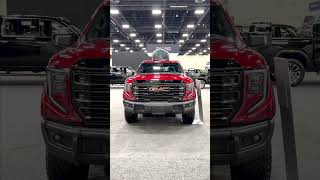 volcanic red 2024 gmc sierra 1500 at4x aev at the calgary auto show - strathmore motor products