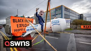 Extinction Rebellion (XR) activists block UK Amazon depots | SWNS