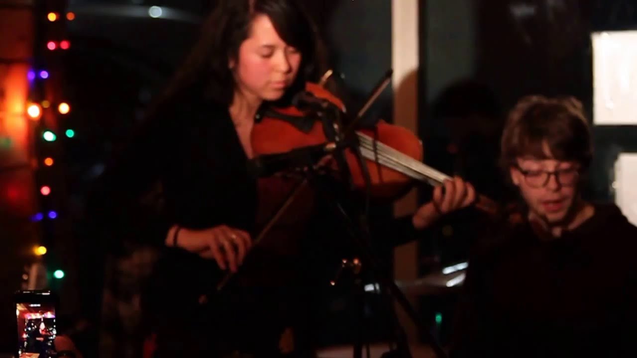 Musician Zosha sings & Performs backed by Ruckus @OneMicNite™ 