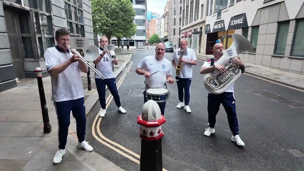 12th Man Brass performing football music in England shirts