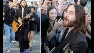 Jared Leto rocks a cropped jacket and sheer shirt as he SURPRISES fans with a FREE acoustic concert