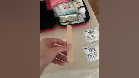 Demonstrating splinting an arm and how to apply a sling with a binder