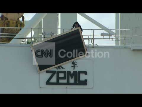 OBAMAMIAMICOVERING CHINESE LOGO ON CRANES