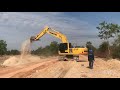 KOMATSU PC210 EXCAVATOR AT WORK