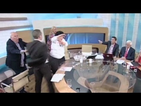 Greek politician throws water, smacks female opponent