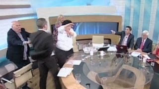 Greek politician throws water, smacks female opponent