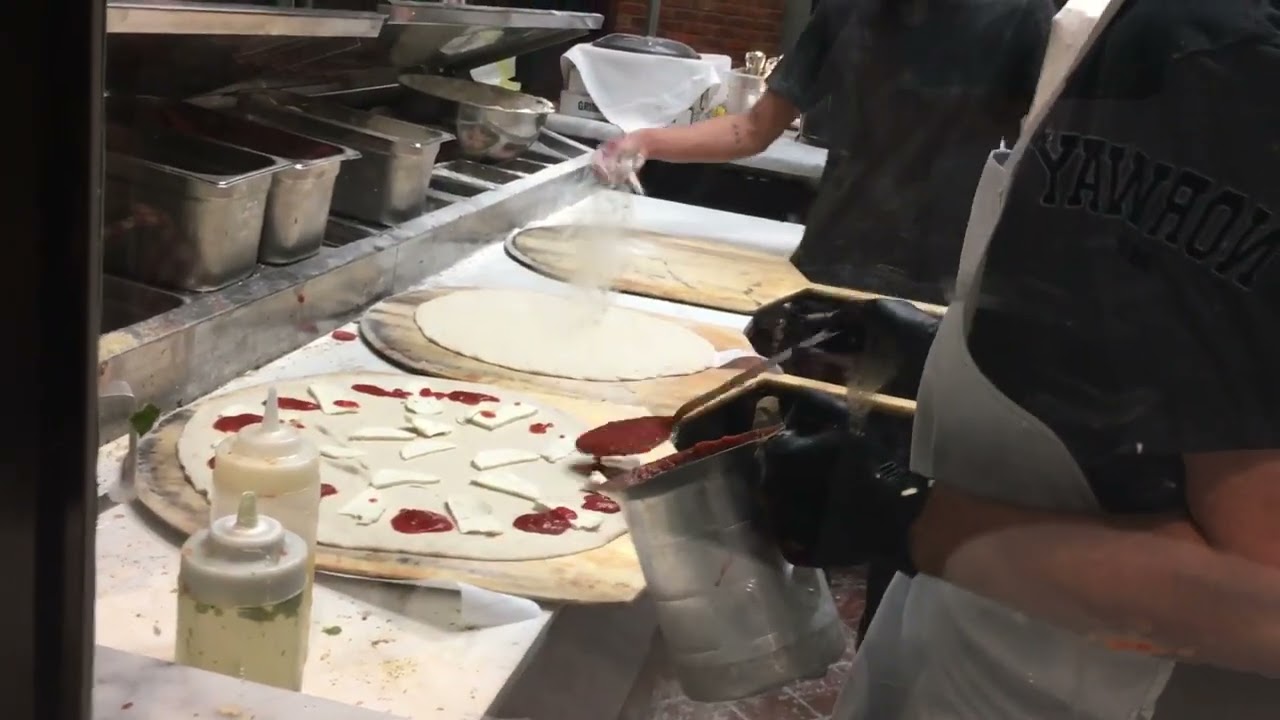 This is how they make pizzas at grimaldi's in Dallas Texas