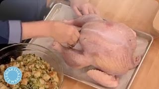 Martha stewart teaches audience members how to stuff a turkey with
walnut stuffing and baste it tasty white wine mixture. brought you by
ste...