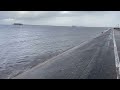 High tide lapping the Southport sea wall