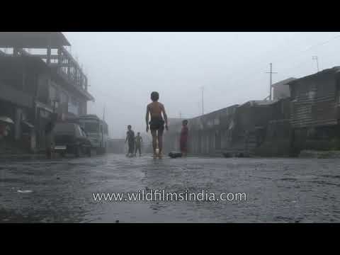 Cherrapunji Children playing a game of football in the rain