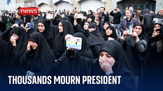 Thousands mourn Iran's president and others celebrate his death