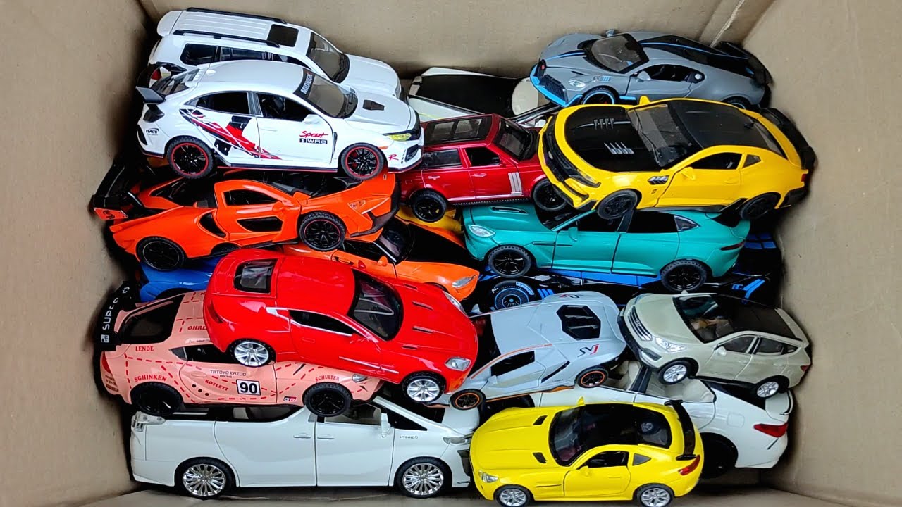 box-full-of-model-cars-rolls-royce-cullinan-jeep-rubicon-toyota-ae86