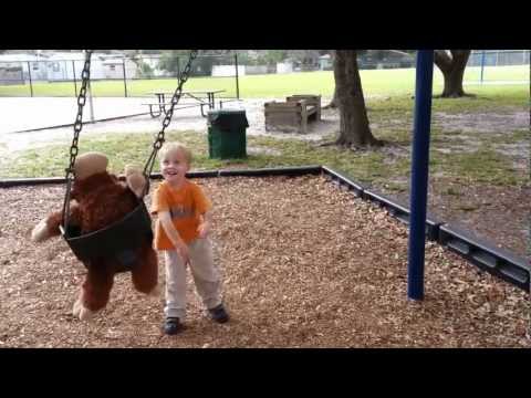 Toren pushing monkey on swing