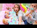 Kids pretend play with baby dolls feeding and night time routine