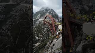 The process of building a bridge across a mountain