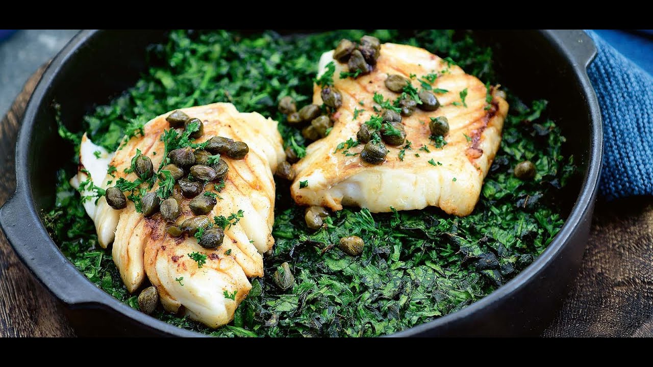 Gebakken kabeljauw met kruidige spinazie uit de oven