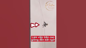 Giông gió bất ngờ kéo đến anh thợ lơ lửng không trung