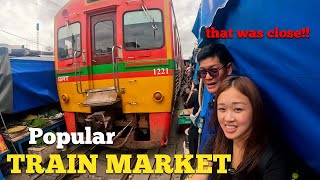 UNUSUAL TRAIN run through market-Maeklong Railway Market(Talad Rom Hub). Must see in Thailand