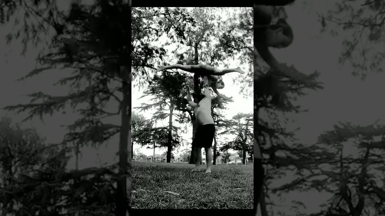 man pressing awesome lady overhead while showing amazing strength and dexterity. acro