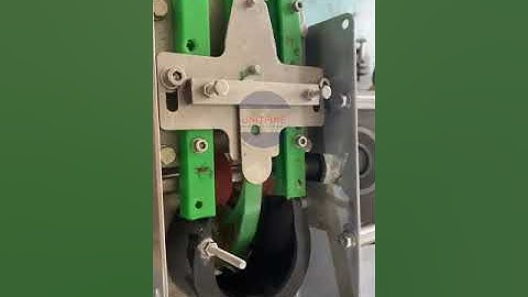 Can Lid Feeder with Magnetic Conveyor