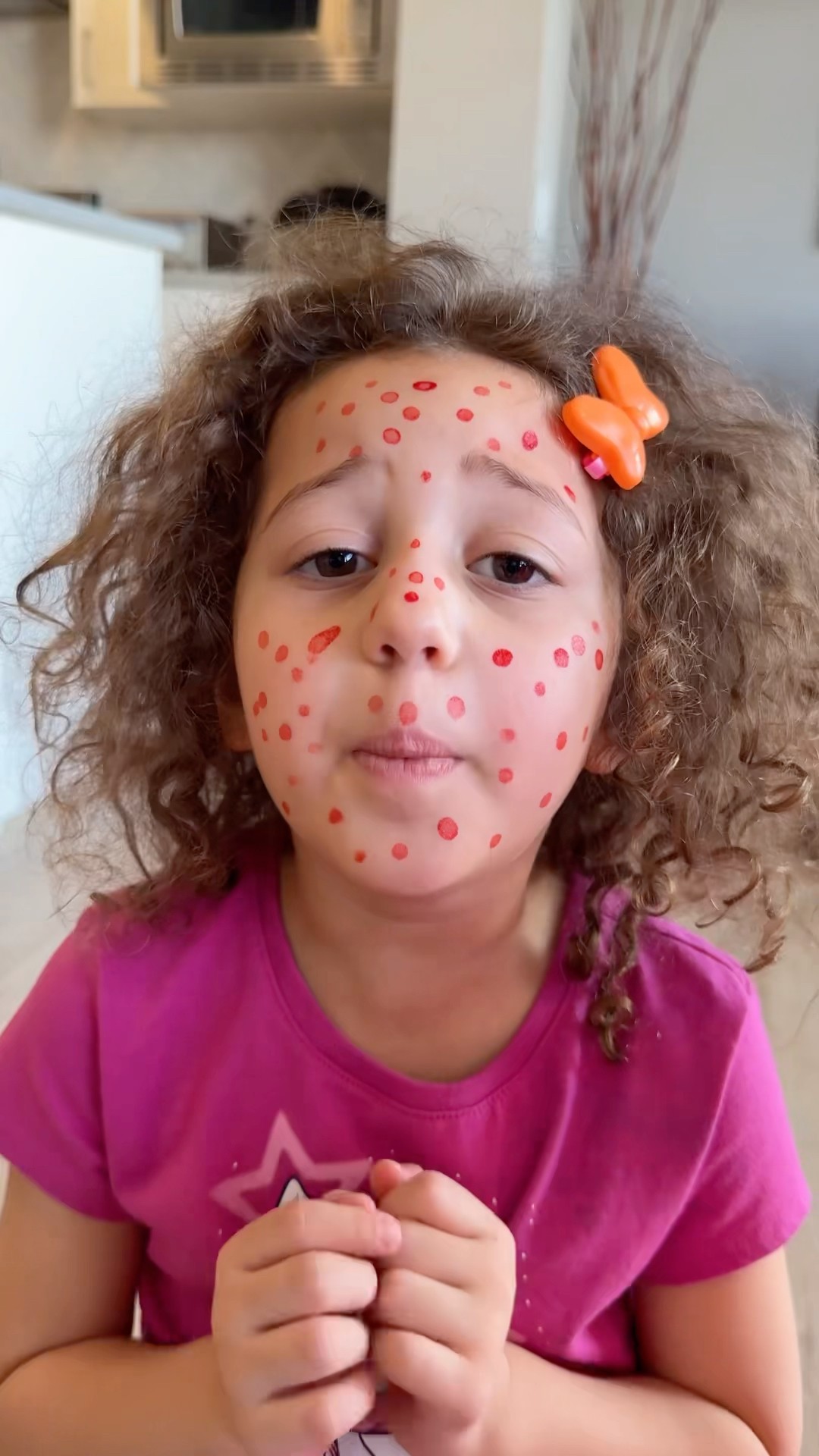 Sierra teaches Rhia safety rules to use only kids safe make up