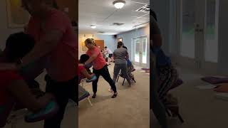 Students learning chair massage