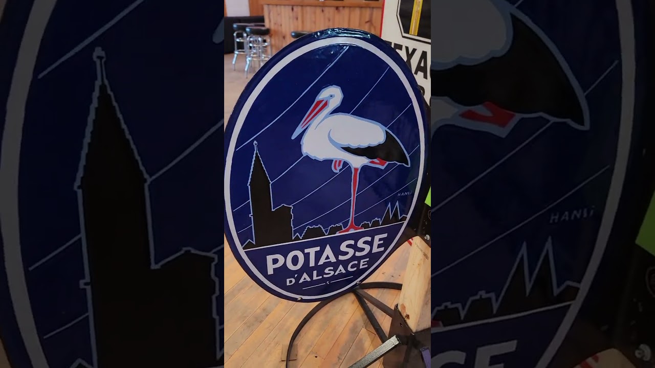 Selection of advertising flange sign on Matthews Auctions July 27