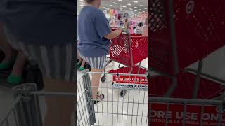 Small service dog in training with wheelchair in target heeling