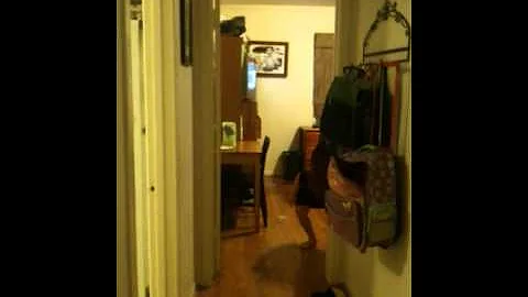Arabella cleaning her room