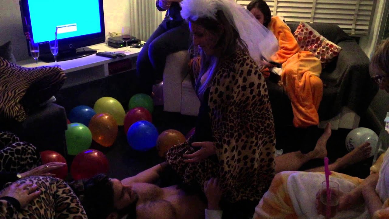 Butlers with Bums at a hen party in Brighton popping balloons.