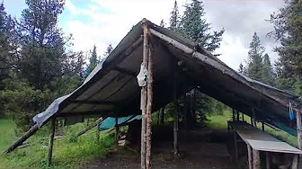 Deer bush camp in mountains  by river
