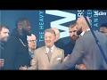 Deontay Wilder shoves Tyson Fury  at their first press conference.