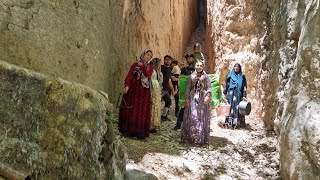 Journey of Tribal Family through WaterFilled Gorge with Challenging Passages