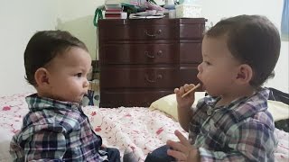 Twins fighting over cracker