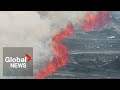 Iceland volcano eruption spewing lava, clouds of hot ash