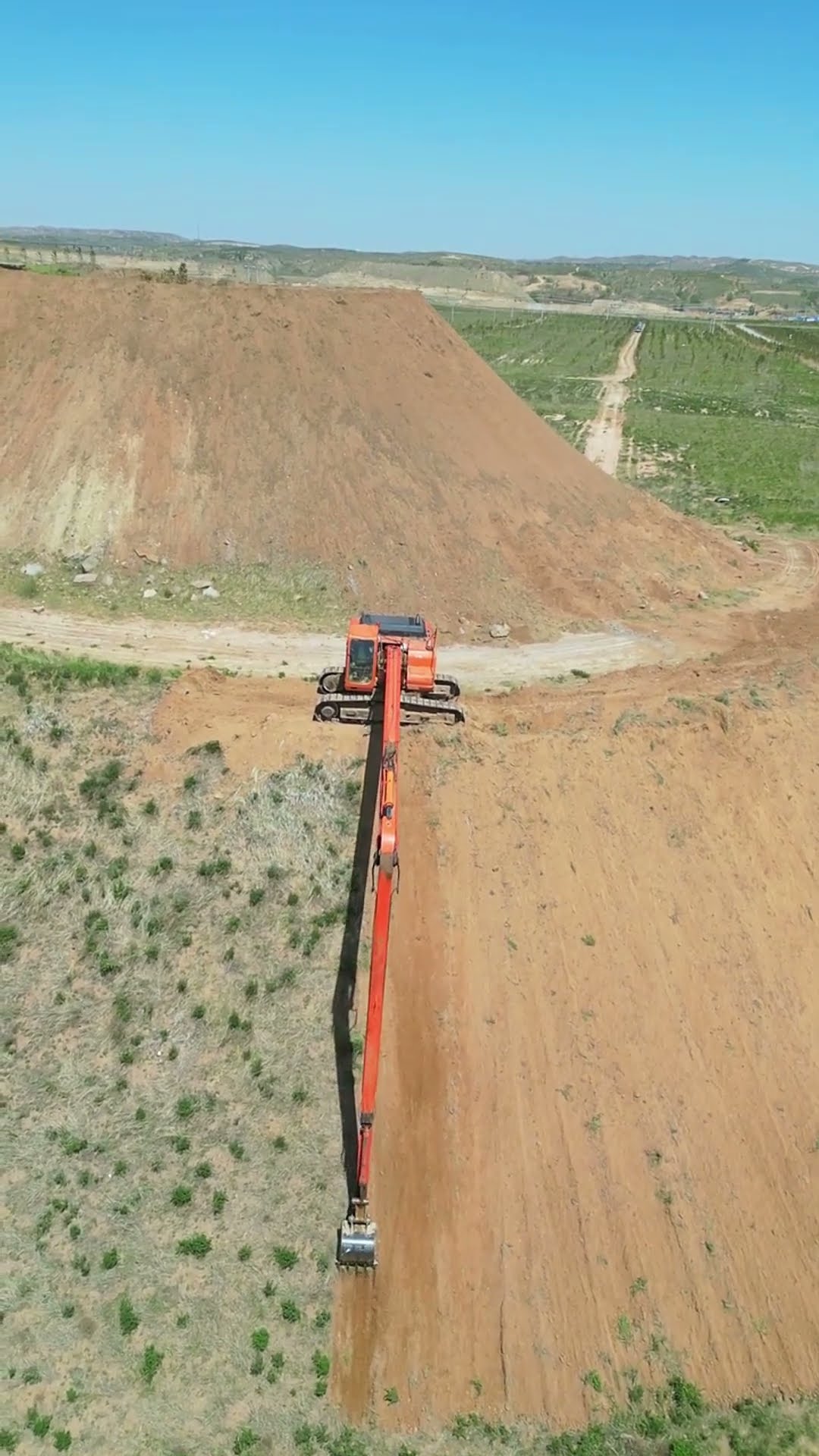 Long arm excavator removing slope grass process- Good tools and machinery make work easy