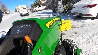 Plowing snow for neighbors & pulling sleds  John Deere 1025R