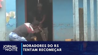 Moradores tentam recomeçar após a tragédia no RS