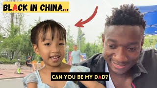 Chinese little girl feels happy with black man and wants me to become her dad