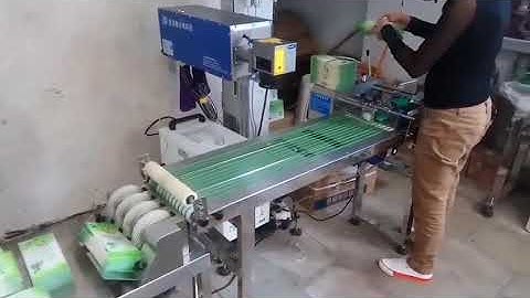 Automatic laser printing machine for pouches