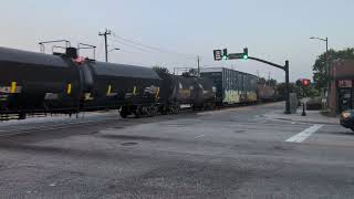 CSX 3288 and CSX 928 lead a good sized north bound mixed freight down Winslow Street 7/03/2026