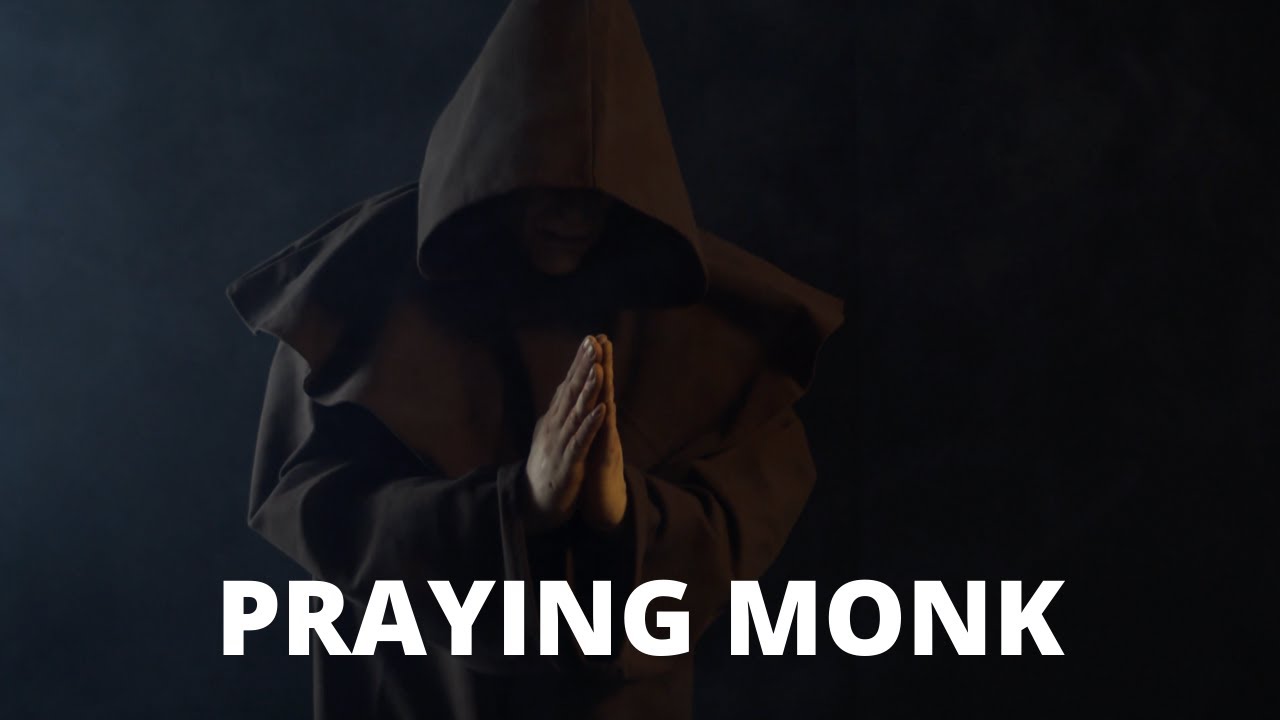 PRAYING MONK